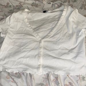 Two white crop top shirts